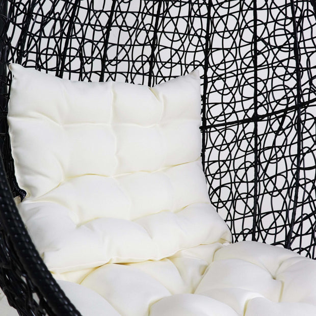 This is a product image of Black Cocoon Swing Chair White Cushion. It can be used as an Outdoor Furniture.