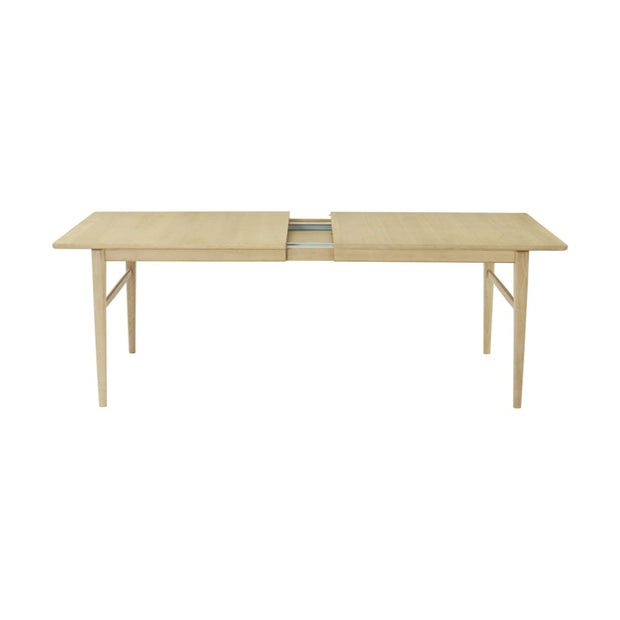 This is a product image of Hampton 6-10 Seat Extendable Dining Table in Oak Veneer. It can be used as an.